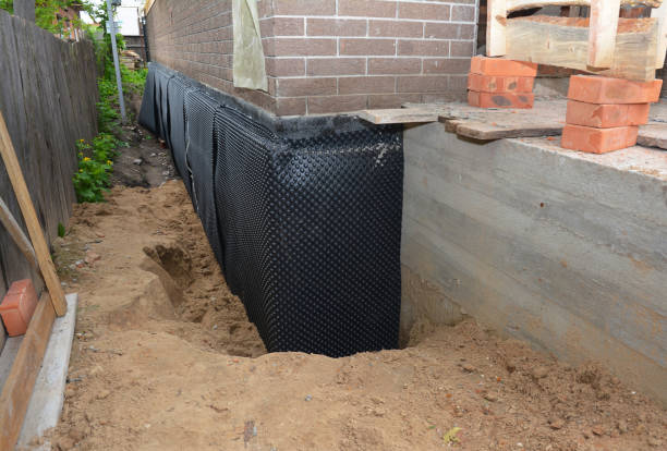 SJ Waterproofing Pros technician performing targeted Emergency Waterproofing assessment in Delevan, NY